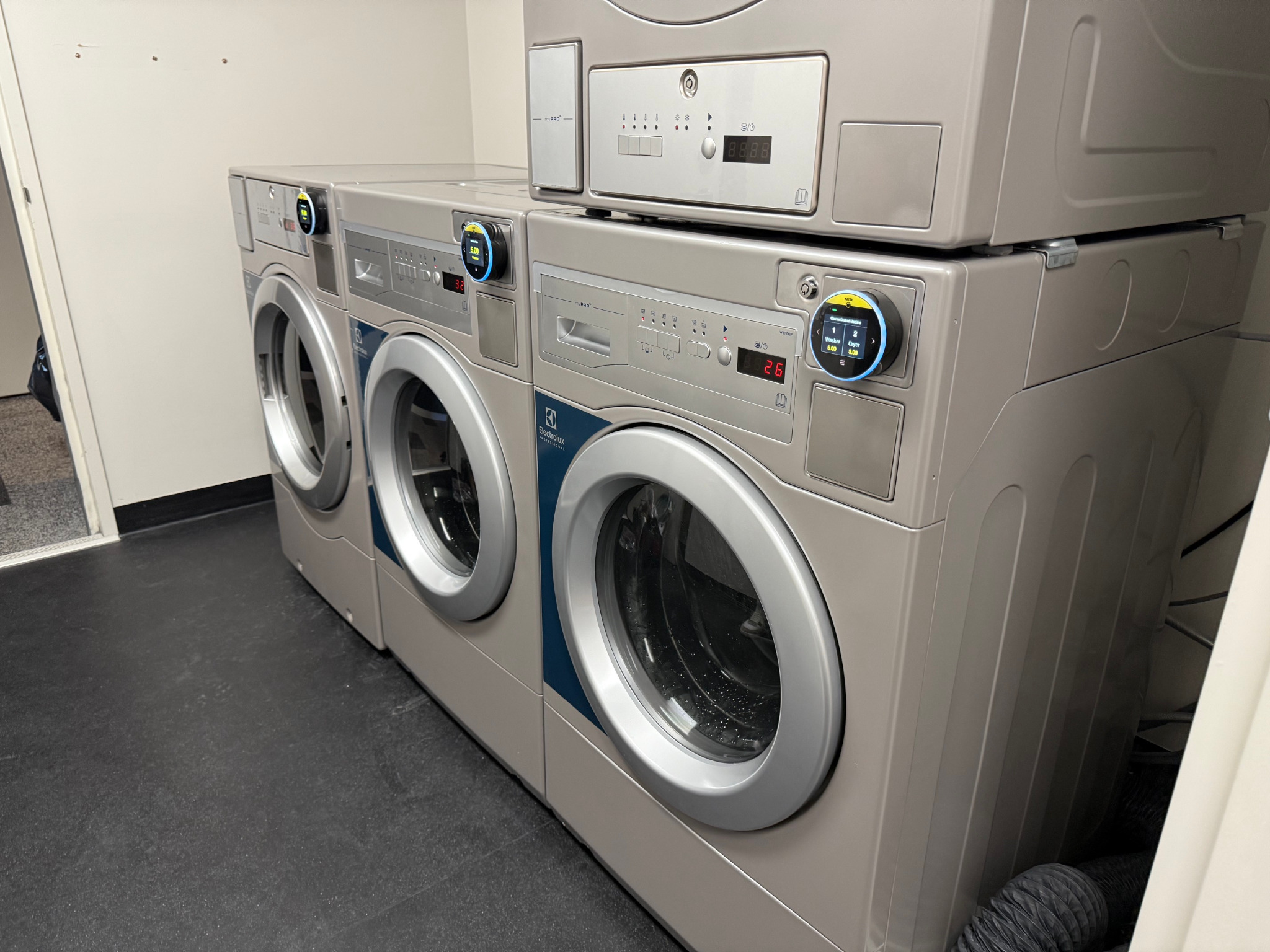Alternative view of the installed washers and dryers with card reader displays